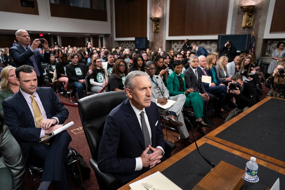 Longtime Starbucks CEO Howard Schultz takes his seat at a crowded Senate Health, Education,...