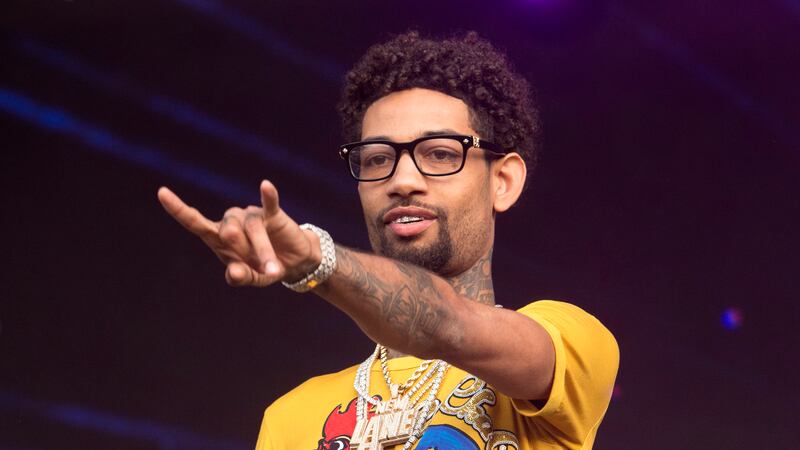 FILE - Two people have been arrested in connection with the fatal shooting of rapper PnB Rock...