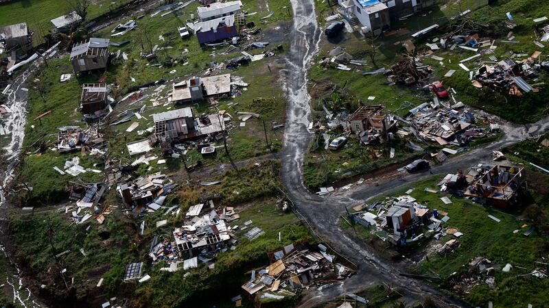FILE - Destroyed communities are seen in the aftermath of Hurricane Maria in Toa Alta, Puerto...