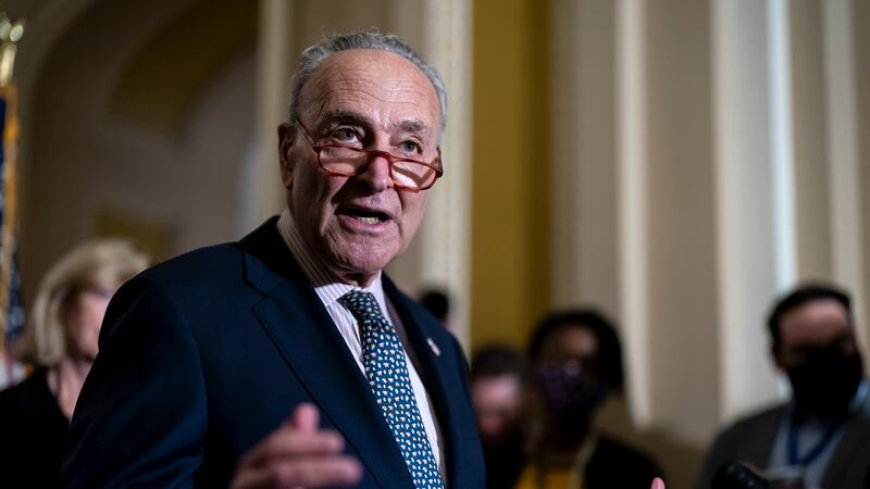 Senate Majority Leader Chuck Schumer, D-N.Y., speaks to reporters as the Senate works to pass...