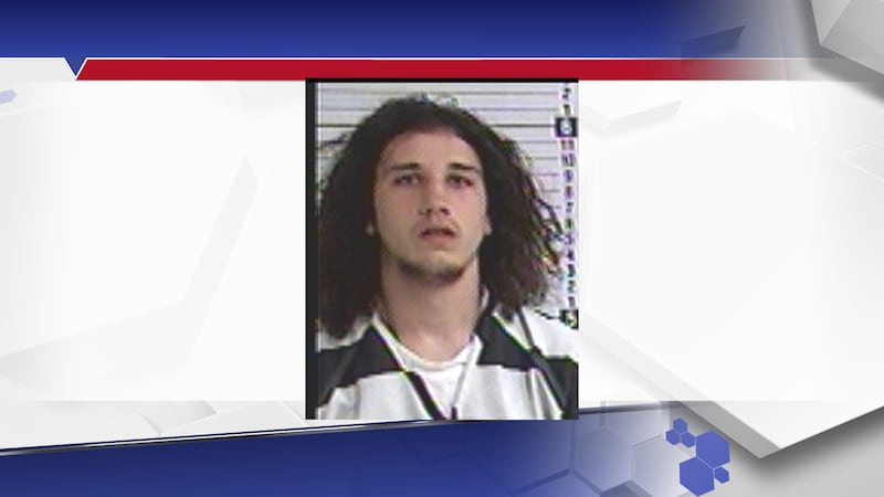 The victim told officers she woke up while sleeping on her couch to see a man standing over her.