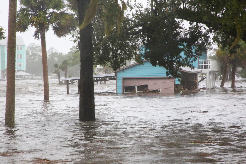 Storm surge floods a home off Riverside Drive on the Steinhatchee River in Steinhatchee, Fla.,...