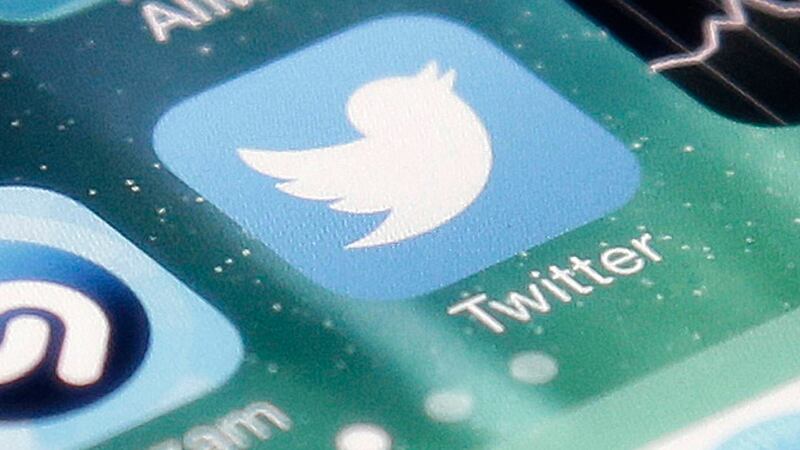 FILE - This Nov. 4, 2013, file photo shows the icon for the Twitter app on an iPhone in San...